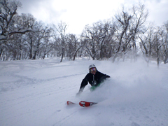 A skier doing a powder slash