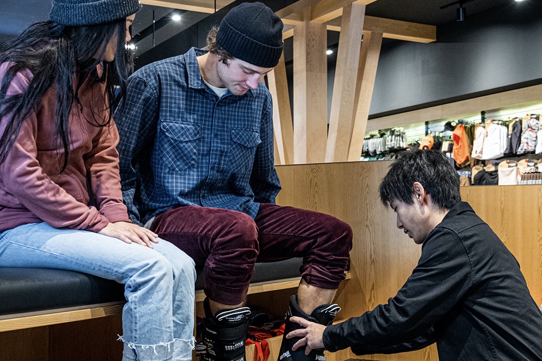 A man getting fitted for ski boots