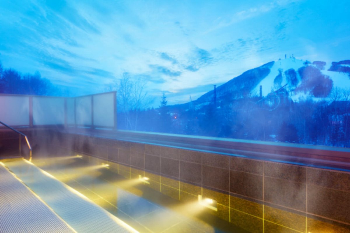 The fantastic mountain view from the outdoor bath at The Westin Rusutsu Hotel